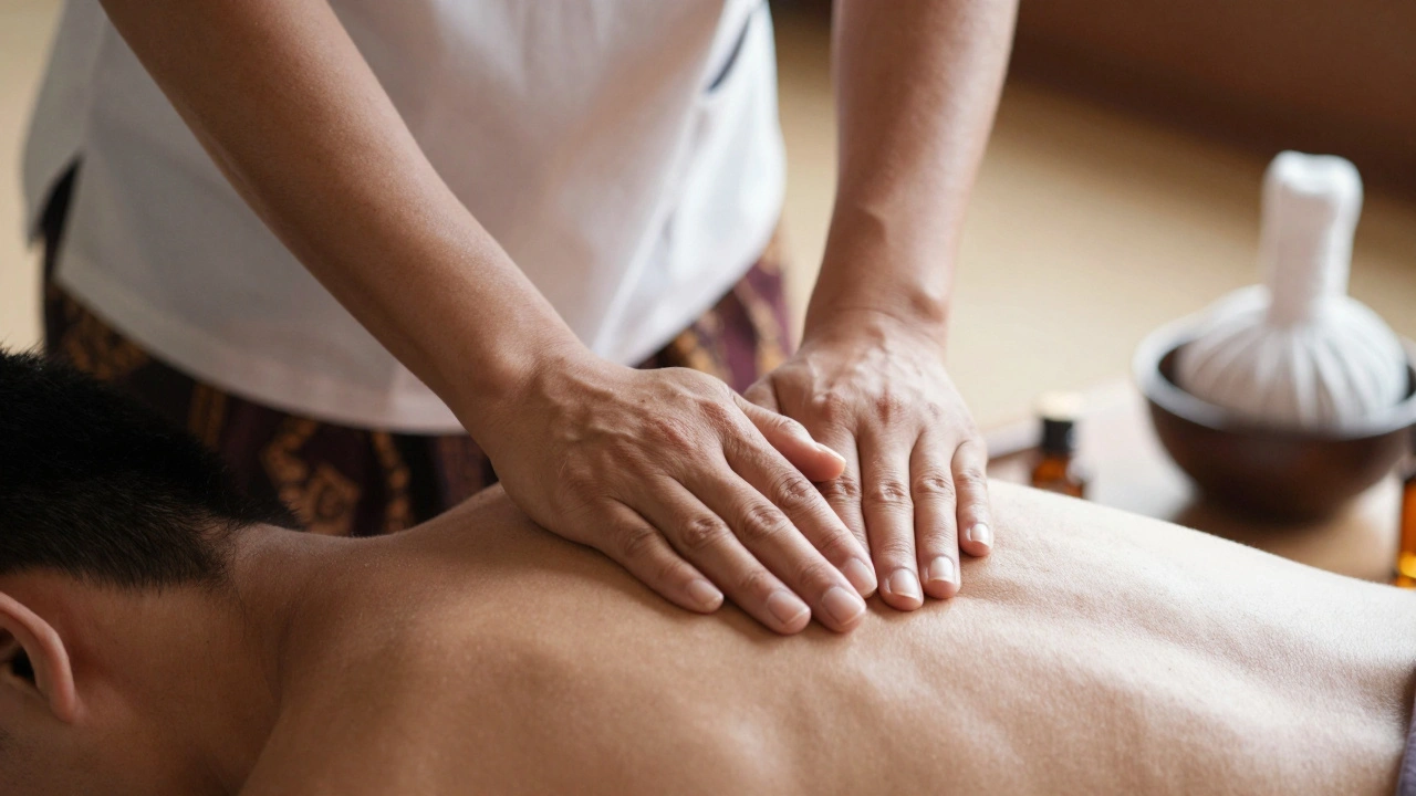 Close-up of hands performing traditional Thai massage therapy technique